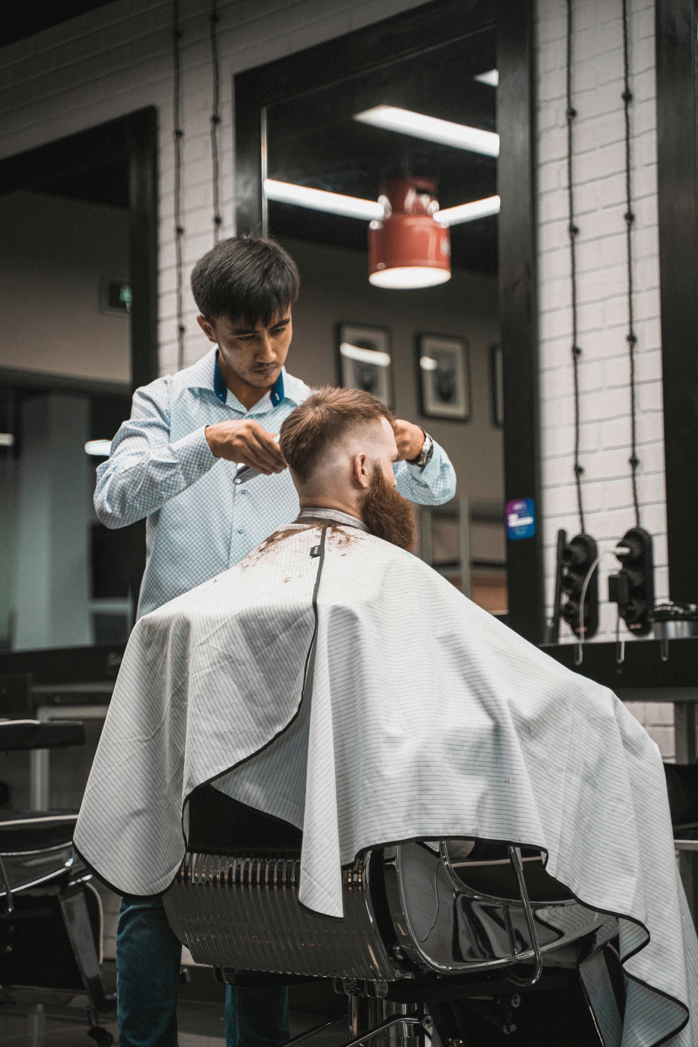 Top Drawer barber delivering a precision fade cut at the Cambridge shop